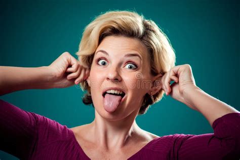 Funny Looking Woman Making Funny Face Showing Tongue And Ears People Lifestyle And Emotions