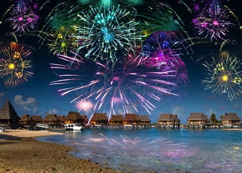 Bright Festive Fireworks Over The Sea And The Beach Stock Photo Image