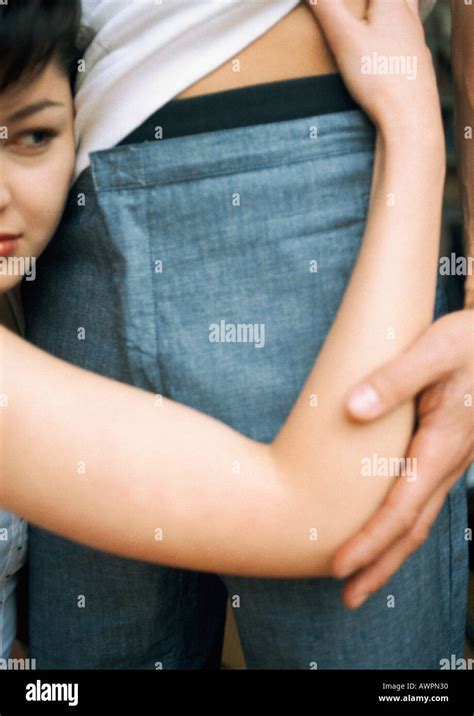 Woman Holding Man Around Waist Close Up Stock Photo Alamy
