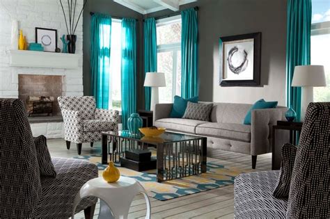All the vibrant colors are lined up on the purple rug. Orange Teal Grey Living Room