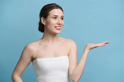 Premium Photo Attractive Smiling Young Woman Holding Imaginary Copy