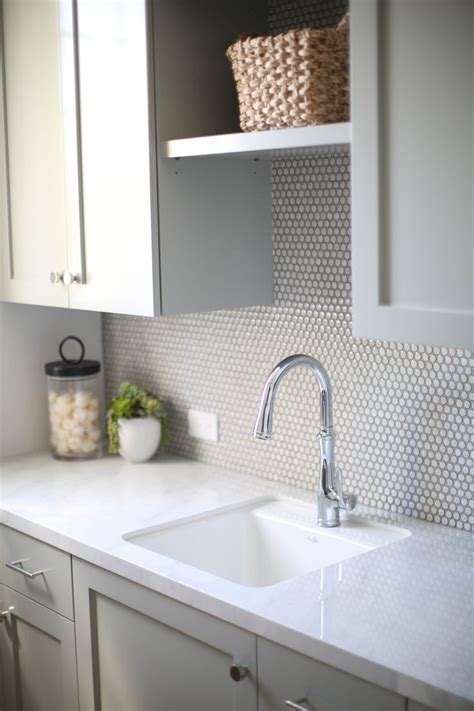 Penny tiles have a retro vibe, but they can be used in ways that minimize the look, such as on a shower floor or as kitchen backsplash tile. Home Reveal: Project Port Margate | Penny tile backsplash ...