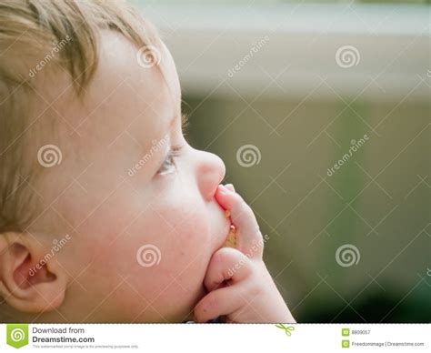 Thoughtful Baby Boy Thinking About Copyspace Stock Image