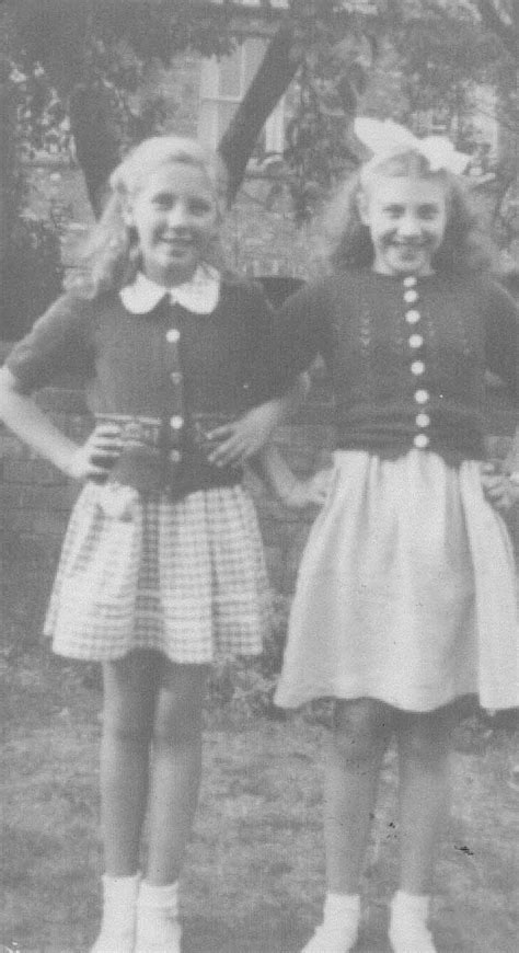 Two Girls Posing In A Garden Living Archive