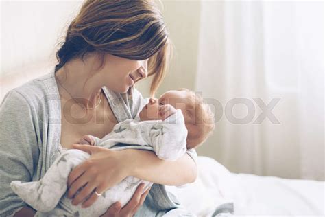 Loving Mom Carying Of Her Newborn Baby At Home Stock Image Colourbox