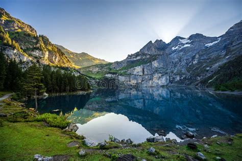 Lake Oeschinensee In The Morning During Sunrise In Switzerland Stock