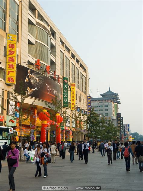 Beijing road is a busy commercial street in central guangzhou. People walking in pedestrian area and malls photo ...