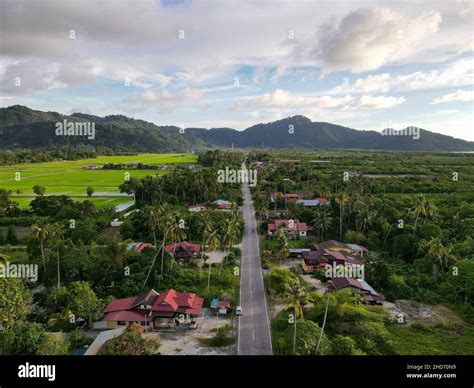 Aerial View Asphalt Road And Rural Malays Kampung House At Balik Pulau