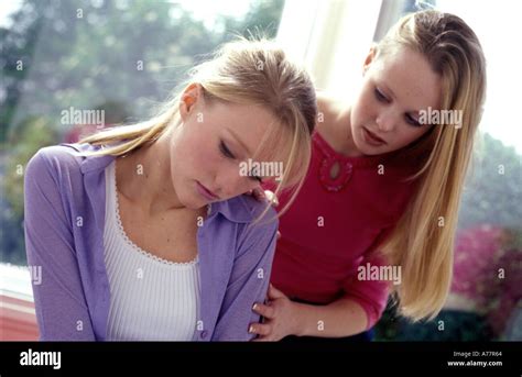 Teenage Girl Comforting Her Friend Stock Photo Alamy