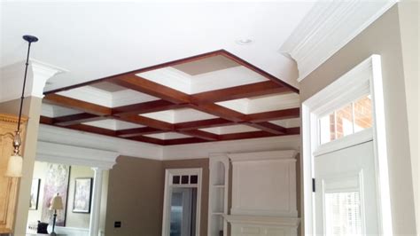 By adding a coffered or box beam ceiling made of softwood lumber, you can make an. Faux wood beams on a coffered ceiling - Yelp