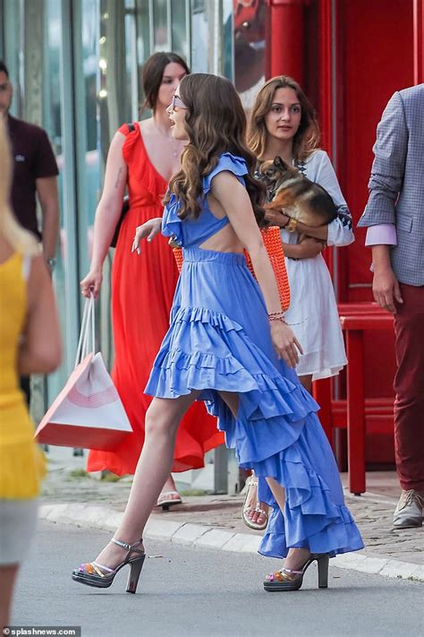 Lily Collins Steps Onto Emily In Paris Set In Ruffled Lilac Sundress