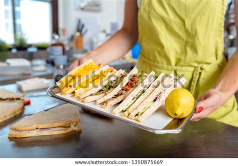 Closeup Womans Hand Carrying Sandwich Tray Stock Photo