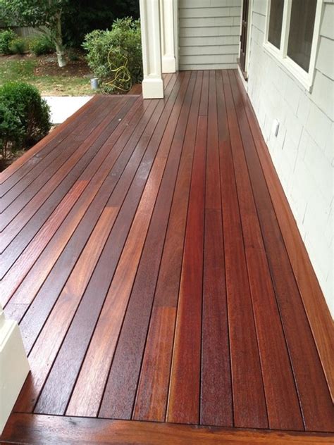 We just bought this raised ranch and the front porch looks like a 'deck' vs. Front Porch - stain