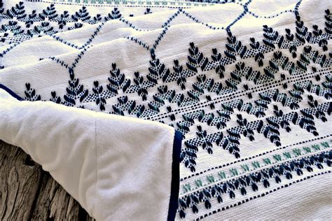 This Afghan Is Hand Embroidered With An Intricate Pattern In A