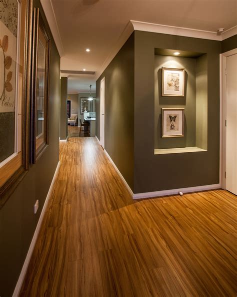 This Hallway Is Full Or Artwork And Recessed Walls With Feature Lights