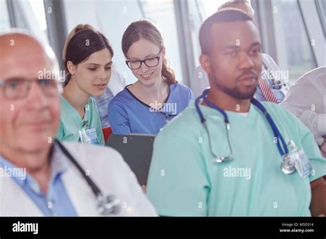 Female Nurses Talking In Conference Audience Stock Photo Alamy