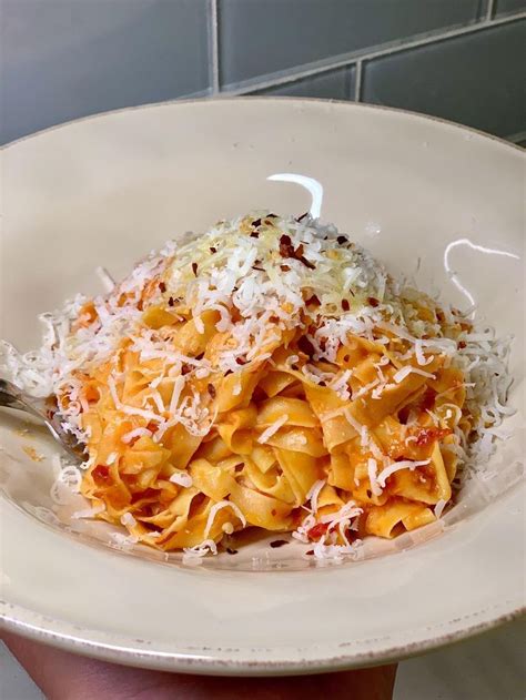 Homemade tagliatelle pasta with Nonnas original tomato sauce Parmesan ...