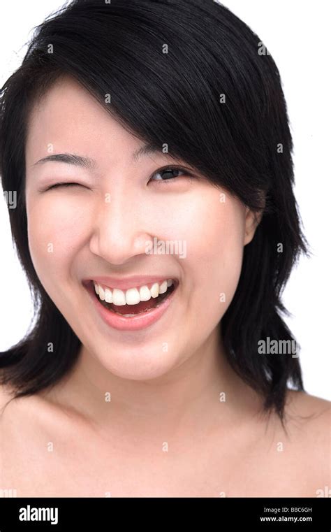 Young Woman Winking Stock Photo Alamy