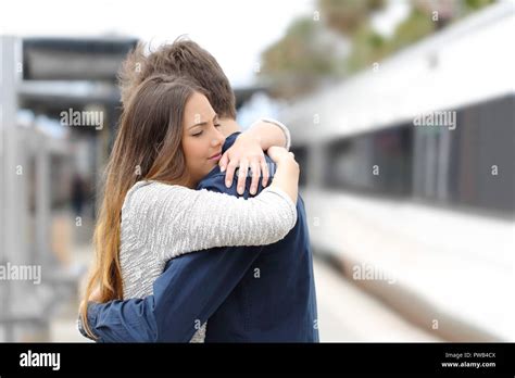 Sad Couple Hugging Saying Goodbye Before Train Travel Stock Photo Alamy