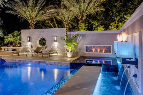 Tropical Pool With Sunken Fire Pit Seating Area Hgtv Ultimate Outdoor