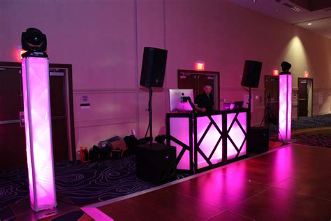 Purple Dj Facade And Trussing Towers With Moving Head Dance Lights On Top Of Towers Wedding Dj
