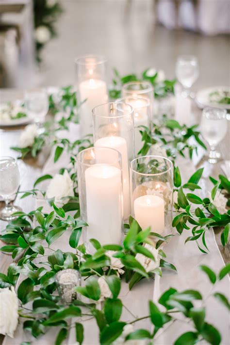 simple candle centerpiece with greenery garland artofit