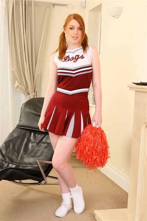 Redhead Cheerleader Wearing White Socks And Red Pleated Miniskirt