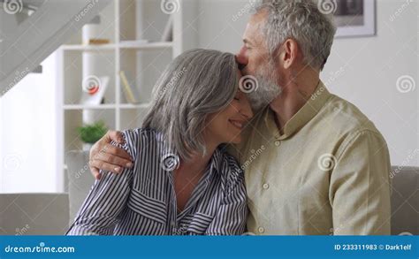 Happy Affectionate Mature Husband Embracing Kissing Wife Enjoying