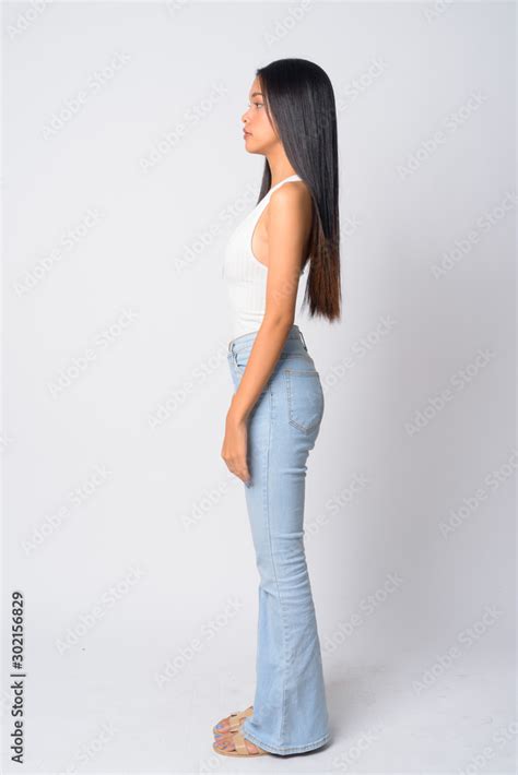 Full Body Shot Profile View Of Young Beautiful Asian Woman Stock Photo