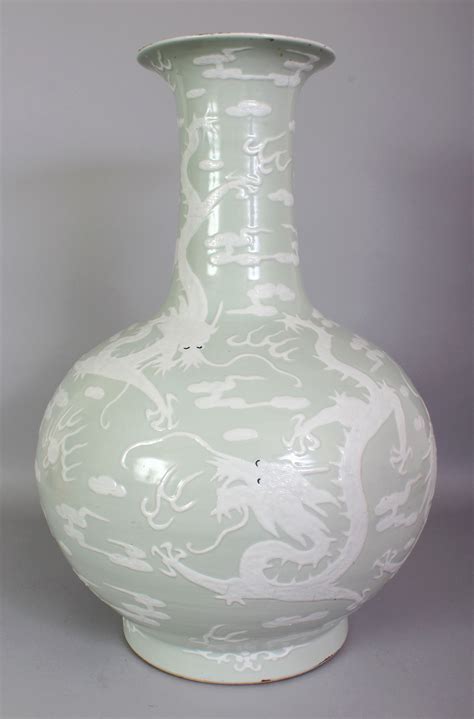 A Good Large 19th Century Chinese White Slip Decorated Celadon Ground