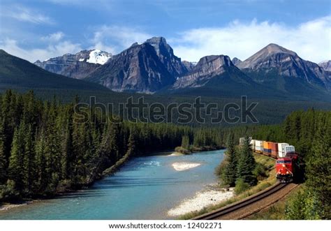 Freight Train Moving Along Bow River Stock Photo Edit Now 12402271