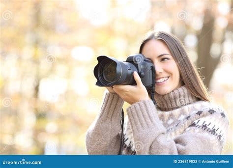 Happy Woman Taking Photos With Dslr Camera In Nature Stock Image