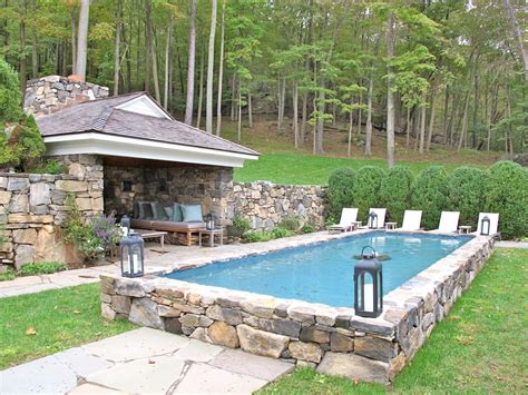 This takes a bit of work but it can be done by just about anyone and it saves you thousands over buying a new inground pool. Semi-inground pool surrounded by stone. | Above ground ...