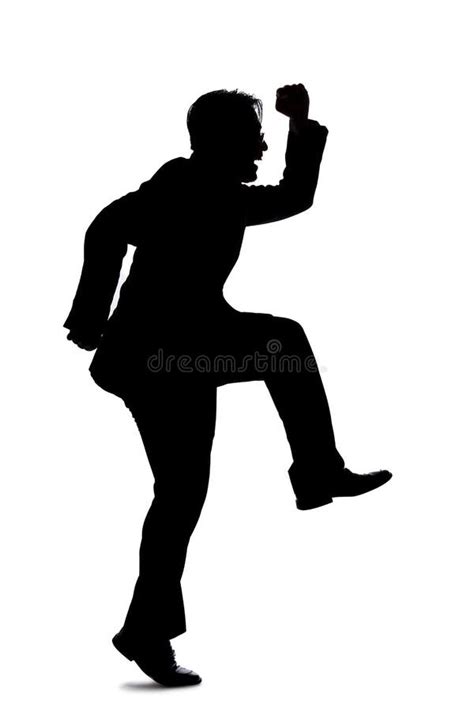 Silhouette Of A Businessman Jumping Forward Stock Photo Image Of