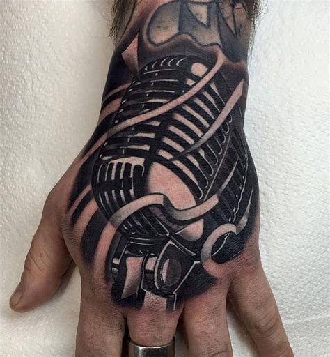 Hand tattoos can be etched in varied shapes and sizes, based on your choice and hand tattoo design. Retro Microphone Hand Tattoo | Best tattoo design ideas