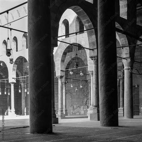 Black And White Shot Of Corridors Surrounding The Courtyard Of Public