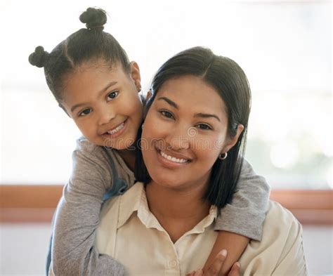 Portrait Of Two Mixed Race Young Females Only Smiling And Looking