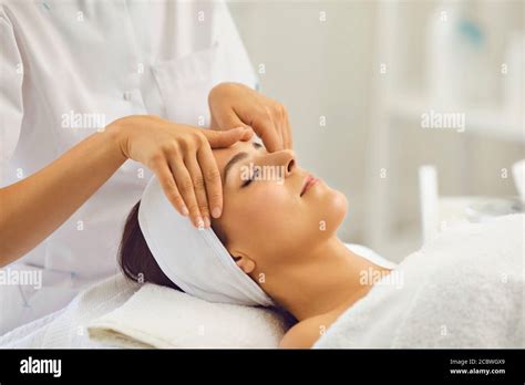 Woman Face Massage A Professional Beautician Makes Massage Treatments