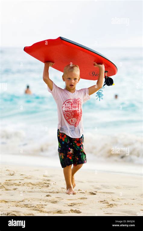 Young Boy Carrying His Bodyboard Hi Res Stock Photography And Images