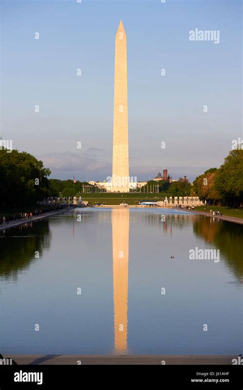 The Washington Monument And Reflection In The Reflecting Pool National