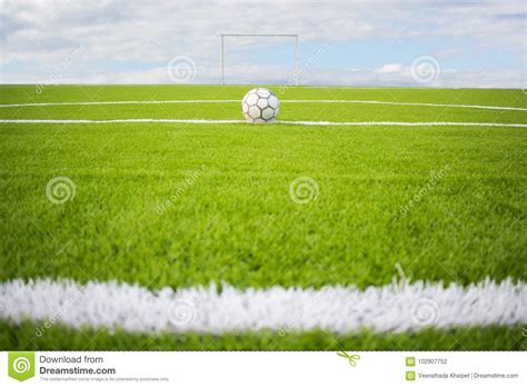 Artificial Turf Football Field Green on Sky Background Stock Photo