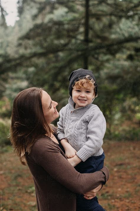 Mother Holding Young Son By Stocksy Contributor Leah Flores Stocksy