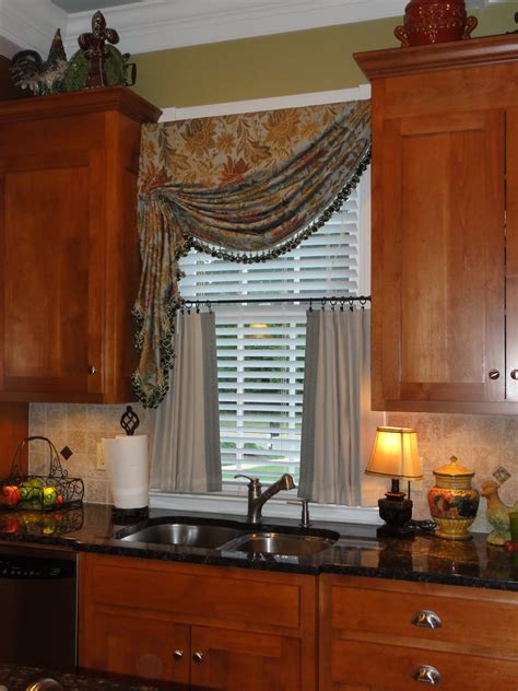 Large lumber pillars hold the glass in place. Window Treatments For Kitchen Ideas - HomesFeed