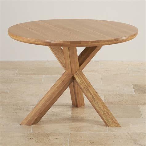 Made of teak wood with iron combination. Trinity Natural Solid Oak Round Table with Crossed Legs