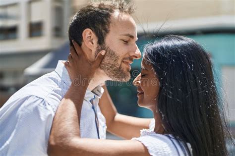 Man And Woman Interracial Couple Hugging Each Other And Kissing At Street Stock Photo Image Of