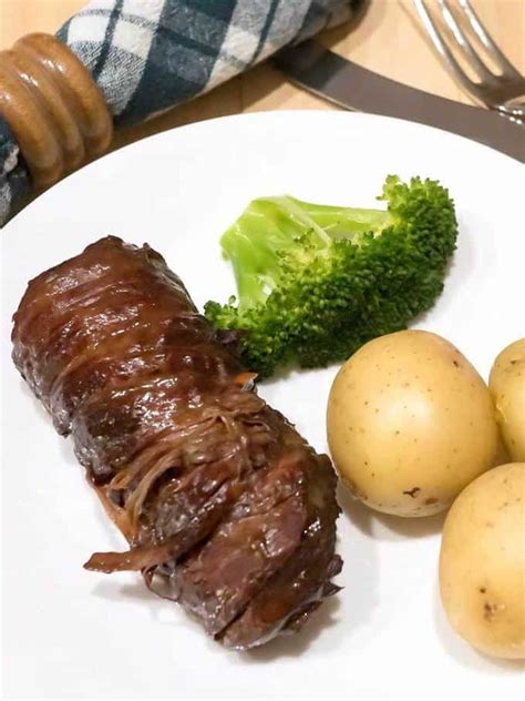 Beef wrapped around a savory stuffing, and cooked in a brown sauce