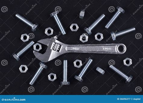 Adjustable Wrench With Screws And Nuts Stock Image Image Of Metallic