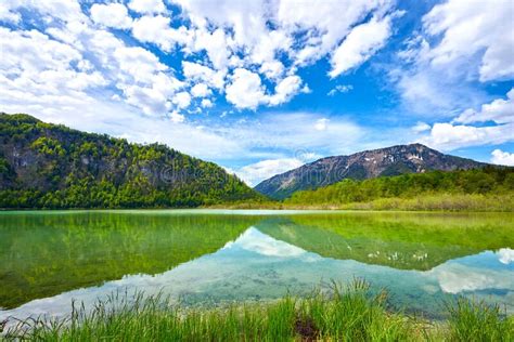 Beautiful Offensee Lake Landscape With Mountains Forest Clouds And