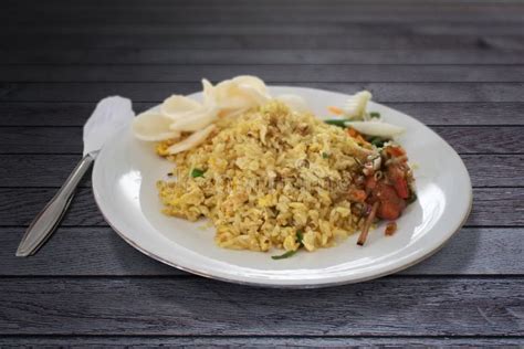 Nasi Goreng Bali With Crackers Nuget And Vegetables On Gray Wood Table