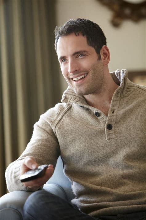 Young Man Watching Television At Home Stock Image Image Of Enjoying
